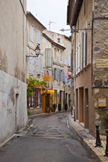 Images Dated 5th June 2009: France, Provence, St. Remy-de-Provence. Art gallery and shops along narrow street