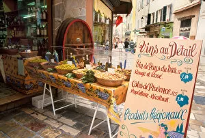 France, Riviera, Hyeres - Olive and wine display with sign advertising local wine
