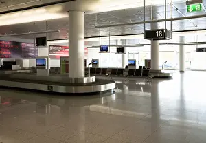 Waiting Prints: Frankfurt, Brandenburg, Germany - An empty baggage carousel in the arrivals section of an airport