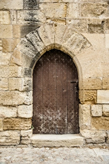 Arched Prints: french medieval arched door in stone wall
