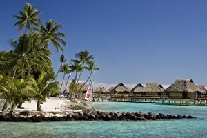 French Polynesia, Bora Bora. Bungalows and beach with Hobie Cat sailboat