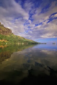 Moorea Prints: French Polynesia, Moorea. Cooks Bay. Cruise ship Paul Gaugin and bay reflection