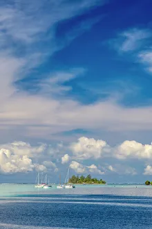 Moorea Prints: French Polynesia, Moorea. Moored boats and small island