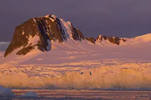 Images Dated 8th February 2007: frozen glacial mountain landscape along the western Antarctic peninsula at sunset