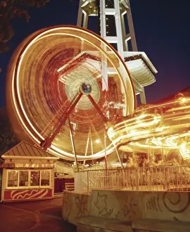 Lights Prints: The Fun Forest at the Seattle Center with the Ferries Wheel and Merry-go-Round in motion