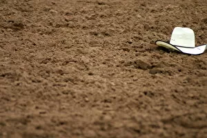 Galisteo, New Mexico, United States. Rodeo hat left in dirt at Galisteo Rodeo