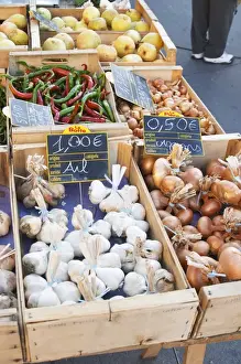 Bunch Prints: Garlic, onions and pimiento peppers for sale at a market stall at the street market in Bergerac