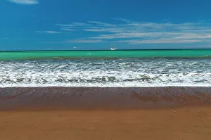 Away From It All Prints: Gentle surf surging onto a sandy beach