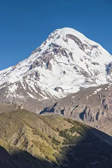 Eurasia Prints: Georgia, Georgian Military Highway, Kazbegi-Stepantsminda. Gergeti Trinity Church and Mt