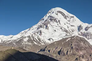 Georgia, Georgian Military Highway, Kazbegi-Stepantsminda. Gergeti Trinity Church and Mt