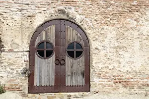 Georgia, Uplistsikhe. A rusted metal and wood door at the Uplistsikhe Cave Complex church