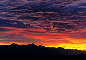 Atmosphere Prints: Germany, Bavaria, Alps. Sunset silhouettes the jagged peaks of the Bavarian Alps