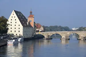 Riverfront Prints: Germany, Bavaria, Regensburg. Historic Salt House & clock tower with the Old Stone