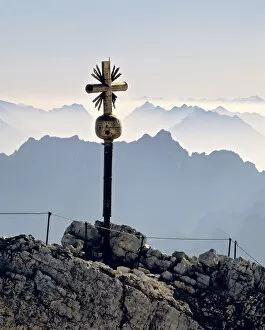 Germany, Bavaria, Zugspitze. A beautiful cross marks the summit of the Zugspitze