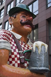 Images Dated 27th December 2013: Germany, Berlin, Mitte, Friendrichstrasse, statue of large Bavarian man with beer stein