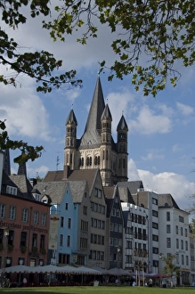 Cologne Prints: Germany, Cologne (aka Koln). Historic St. Martin church. View from waterfront park area