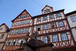 Market Place Prints: Germany, Franconia, Wertheim. Famous Angels Well in front of historic homes
