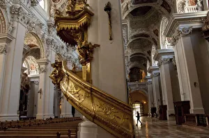 Germany, Passau. St. Stevens Cathedral, baroque interior. Gold spiral staircase