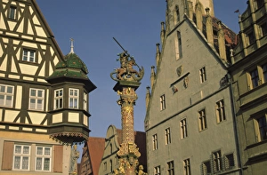 Steve Satushek Prints: Germany, Rothenburg, Looking up at buildings and statue of St. George and the Dragon