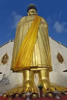 Giant standing Buddha Luang Pho To Wat Intharawihan, Bangkok, Thailand