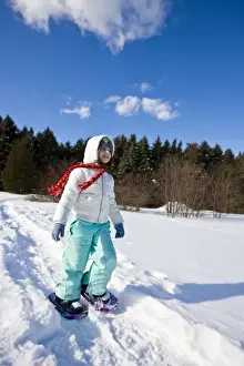 Jerry Marcy Monkman Prints: A girl (age 7) snowshoes through a snowy field at the Urban Forestry Center in Portsmouth