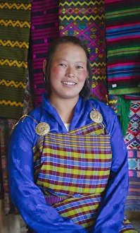 Smile Prints: Girl with colorful fabric, Bhutan. (MR)