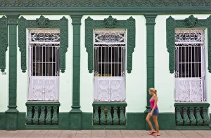 Sancti Spiritus Prints: Girl passying an old house, Trinidad, UNESCO World Heritage site, Cuba