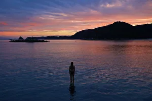 Tasman Bay Prints: Girl in the water at dusk, Mosquito Bay, Abel Tasman National Park, Nelson Region