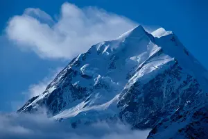 Glacier-clad Mount Cook, the highest mountain in New Zealand rises 12, 349 feet into