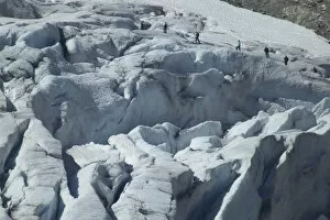 Images Dated 8th June 2004: Glacier hikers wind through the blue ice crevices and over snow fields of Folgefonna Glacier
