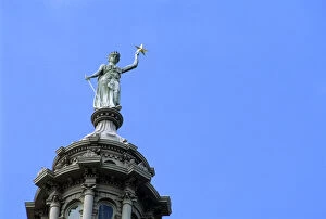 The Goddess of Liberty on top of the Texas state capitol building in Austin
