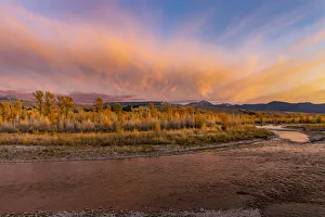 Steam Prints: Golden cottonwood and aspen trees at sunset along river bank of Gros Ventre River