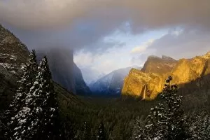 Golden light paints Yosemite Valleys Bridalveil Fall at sunset - Yosemite National Park