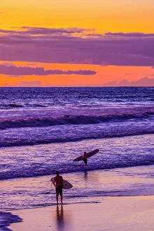 Surfing Prints: The golden light of the setting sun reflects a gold glow on the beach at Pererenan Beach