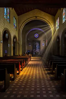 Golden Prints: Golden light of sunrays coming into the stained glass windows of St Leo