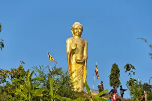 Golden Prints: A golden statue of Buddha on the bank of Kaptai Lake, Rangamati, Chittagong Division