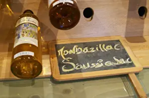 Chalkboard Prints: Golden yellow bottles of sweet white Bergerac and Monbazillac wine on display