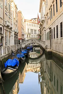 Gondola parking under Bridge. Venice. Italy