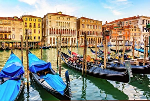 Grand Canal Prints: Grand Canal, Venice, Italy. Wide angle landscape view of medieval buildings and boats lining the canal at sunrise