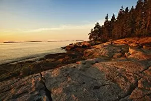 Images Dated 16th August 2005: Granite shoreline of Rockport Harbor at sunrise, Rockport, Maine