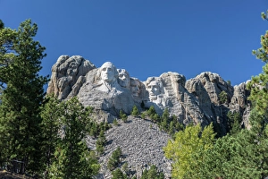 Prints of The granite stone carvings of four US presidents called Mount Rushmore National Memorial, rise up from the Black Hill of western South Dakota, USA Images Dated 2024 November: The granite stone carvings of four US presidents called Mount Rushmore National Memorial