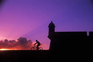 Graphic colorful sunset bike ride at El Morro Fort in Old San Juan, Puerto Rico
