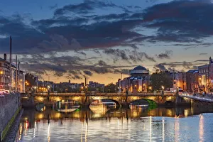 River Liffey Prints: The Grattan Bridge over the River Liffey at dusk in downtown Dublin, Ireland