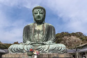 Produce Prints: The Great Buddha, Daibutsu, offerings in front, blue sky above in Kamakura, Japan
