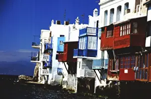 Port City Prints: Greece, Aegean Sea, Mykonos. Waterfront homes and businesses on the edge of the Aegean Sea