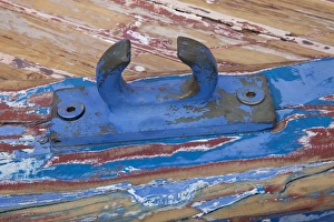Greece, Crete, Chania, Old Harbor. Refinishing wooden boat