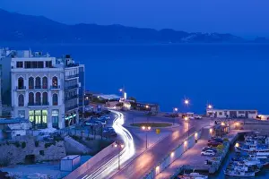 Images Dated 26th May 2006: GREECE-CRETE-Iraklio Province-Iraklio: Dawn Traffic on Plateia 18 Anglon Square by
