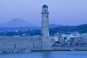GREECE-CRETE-Rethymno Province-Rethymno: Venetian Harbor with lighthouse / Dusk