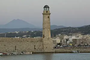 GREECE-CRETE-Rethymno Province-Rethymno: Venetian Harbor with lighthouse / Dusk