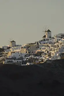 Images Dated 11th May 2009: Greece, Cyclades, Island of Santorini (aka Thira) cliff top homes & typical windmill